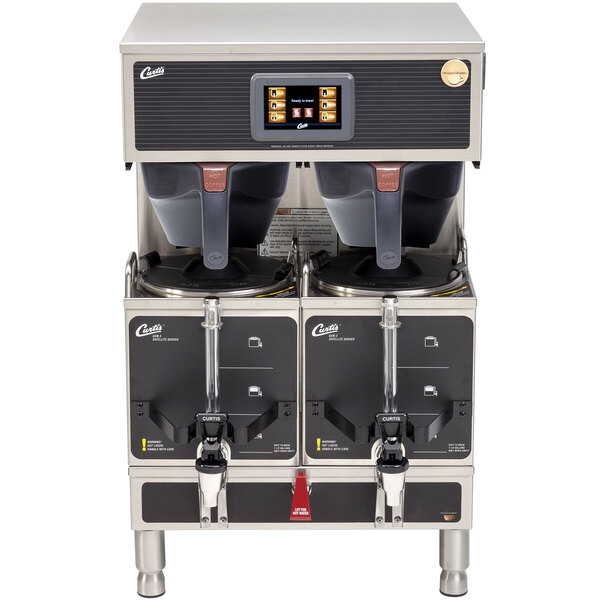 A Curtis stainless steel twin satellite coffee brewer with two coffee pots on top.