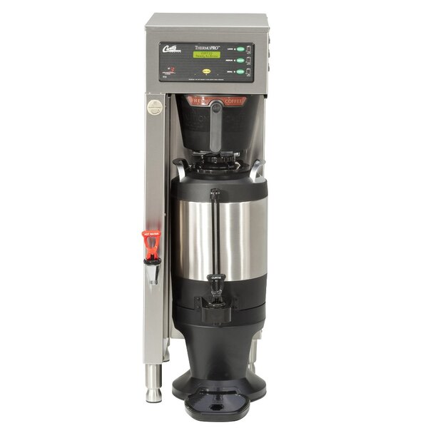 A Curtis ThermoPro coffee brewer with a stainless steel base and black container.