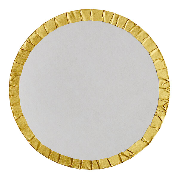 A round white plate with gold trim.