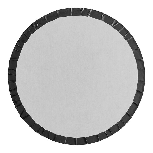 A white circular cake drum with black tape around the edge.