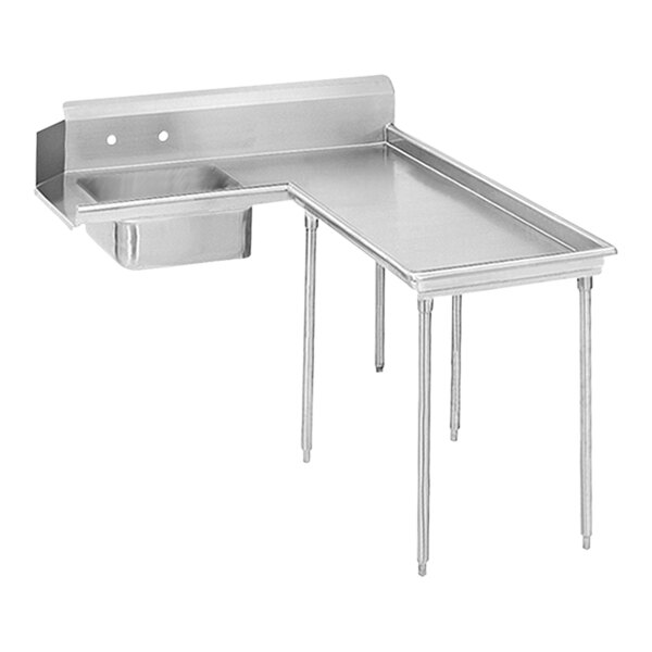 A stainless steel L-shaped dishtable with a shelf on a counter.