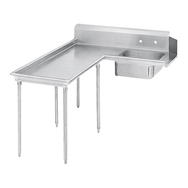A stainless steel L-shape dishtable with a sink on a counter.