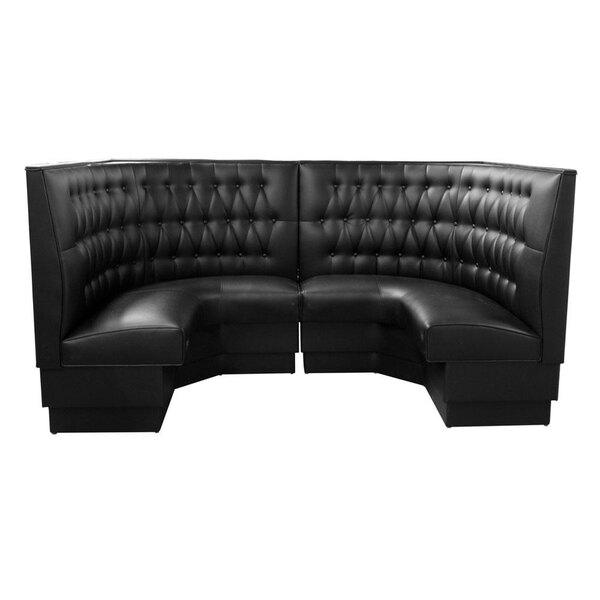 An American Tables & Seating black button tufted corner booth with a curved back.