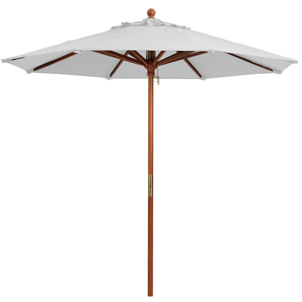 A white Grosfillex market umbrella with a wooden pole.