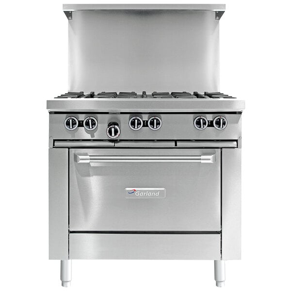 A stainless steel Garland commercial gas range with 2 burners, a griddle, and a convection oven.