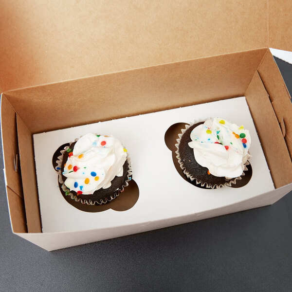 A Baker's Lane reversible cupcake insert holding two cupcakes in a box.