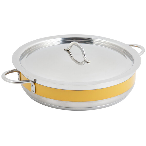 A Bon Chef Cucina stainless steel pot with yellow handles and lid.