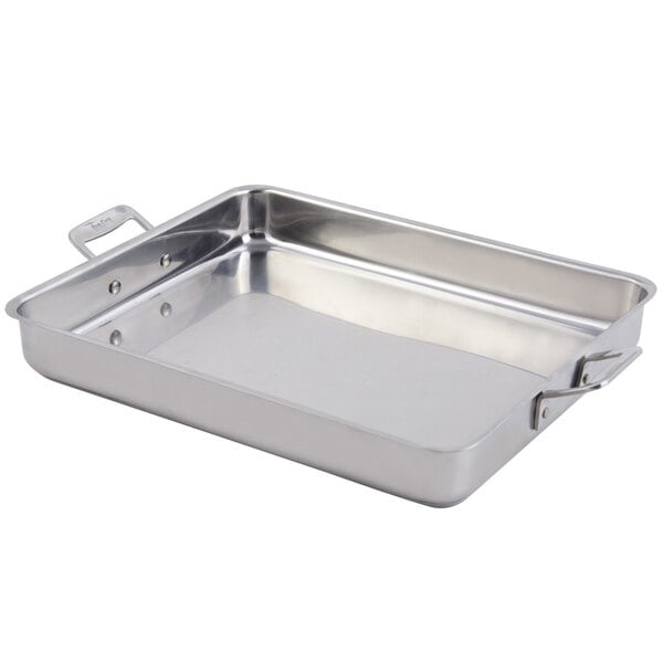 A stainless steel Bon Chef Cucina rectangular roasting pan with handles on a white counter.