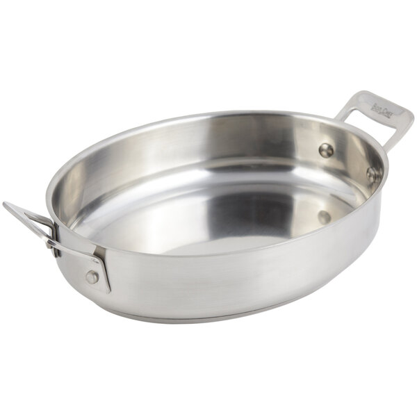 A silver stainless steel Bon Chef oval au gratin pan with handles.