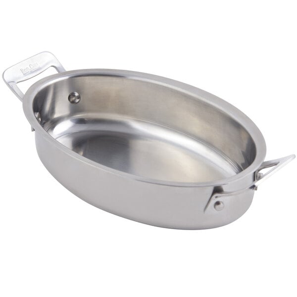 A silver stainless steel oval pan with handles.