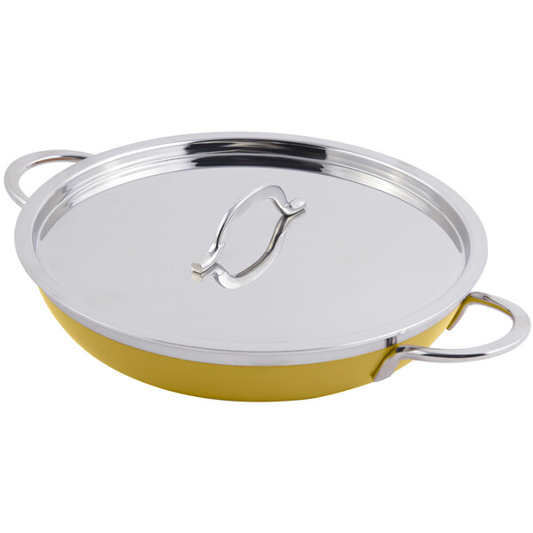 A yellow Bon Chef saute pan with a silver lid and double handles.
