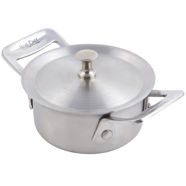 A stainless steel Bon Chef round dish with a lid.