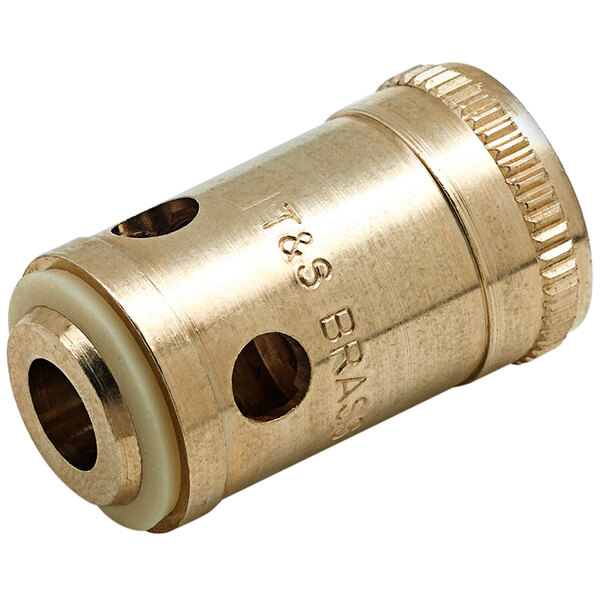 A brass cylinder with a hole in the middle.