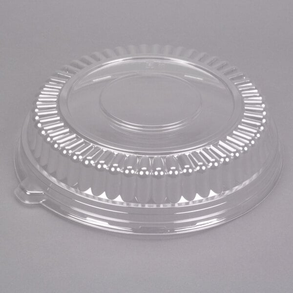 A clear plastic Fineline container with a round low dome lid.