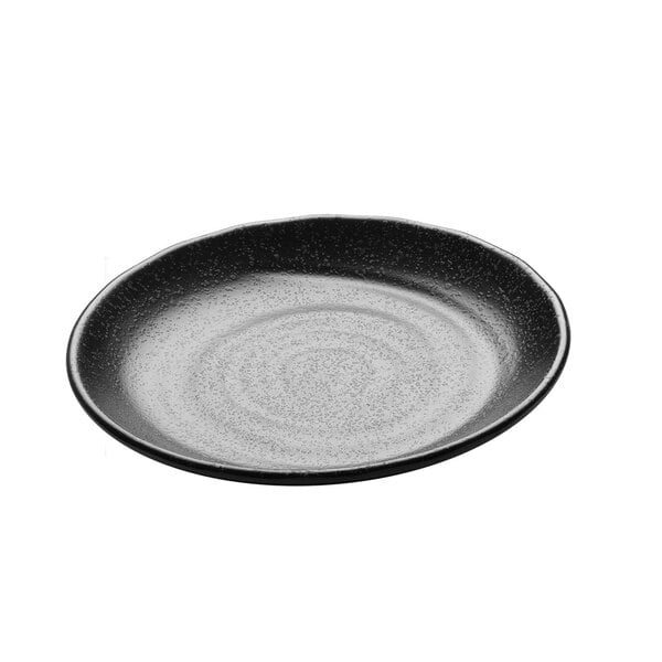 A black plate with a speckled surface.
