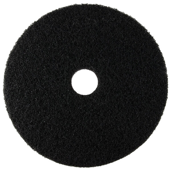 A black Scrubble by ACS 72-21 stripping floor pad with a hole in the middle.