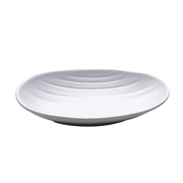 A white Elite Global Solutions deep oval plate with wavy lines on it.