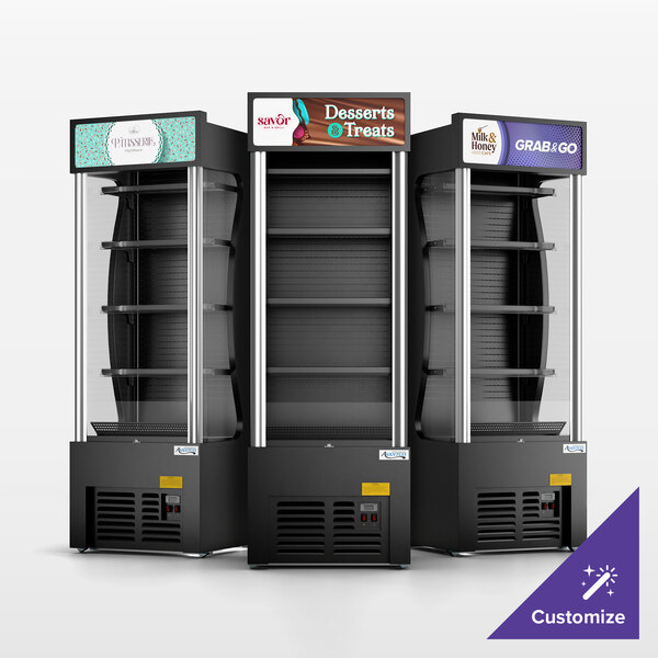 A set of three black refrigerated air curtain merchandisers with customizable signage at the top.