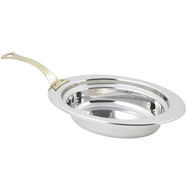 A Bon Chef stainless steel full size oval food pan with a long brass handle.