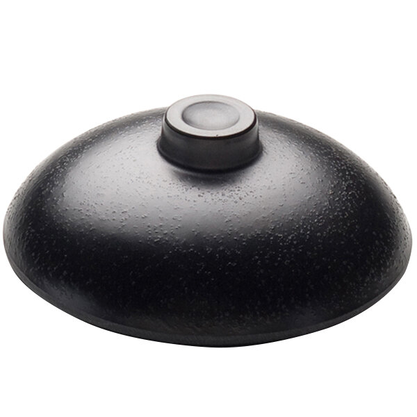 A black round lid with a round center.