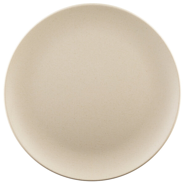 A close-up of an Elite Global Solutions Papyrus-colored round plate with a white background.