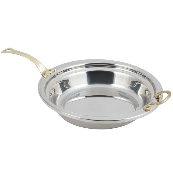 A Bon Chef stainless steel casserole food pan with long brass handle.