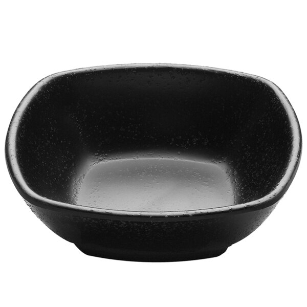A black Elite Global Solutions melamine square bowl with water drops on it.