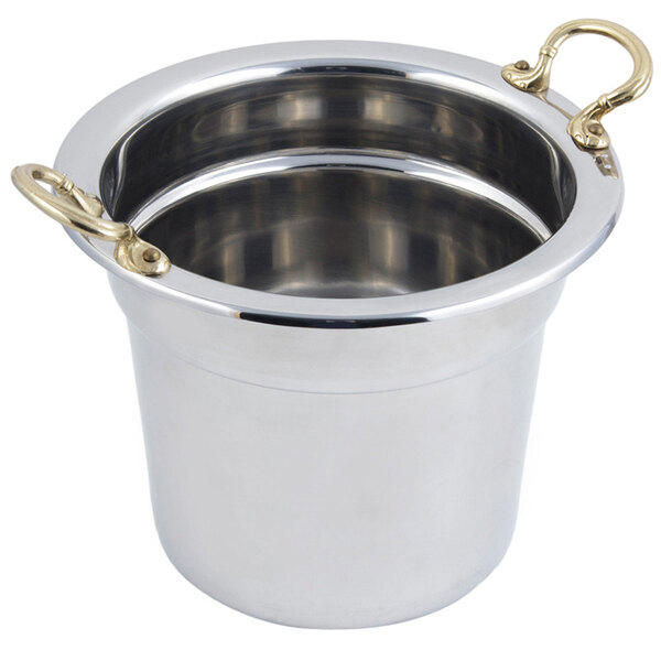A stainless steel Bon Chef soup inset with round brass handles.