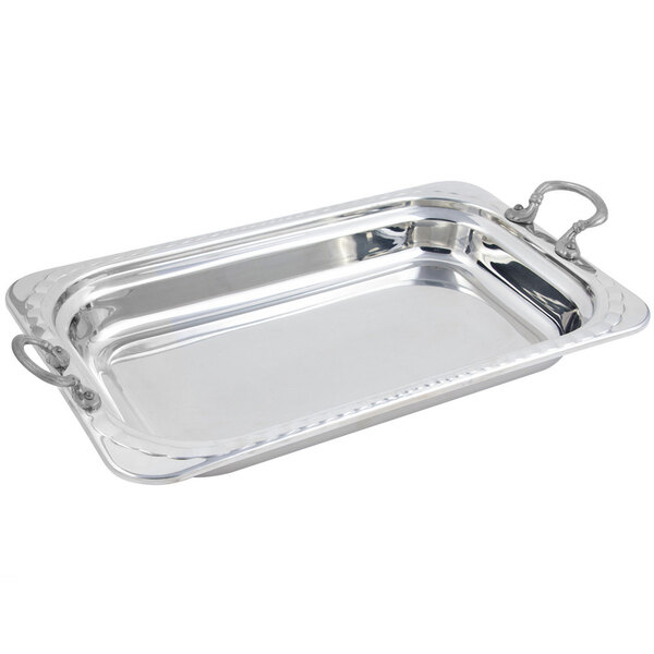 A Bon Chef stainless steel rectangular food pan with arched design and round handles.