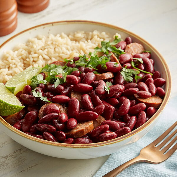 A bowl of Bella Vista dark red kidney beans and rice with cilantro and lime.