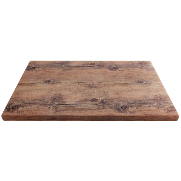 A rectangular faux driftwood melamine riser with a wood surface and knots.