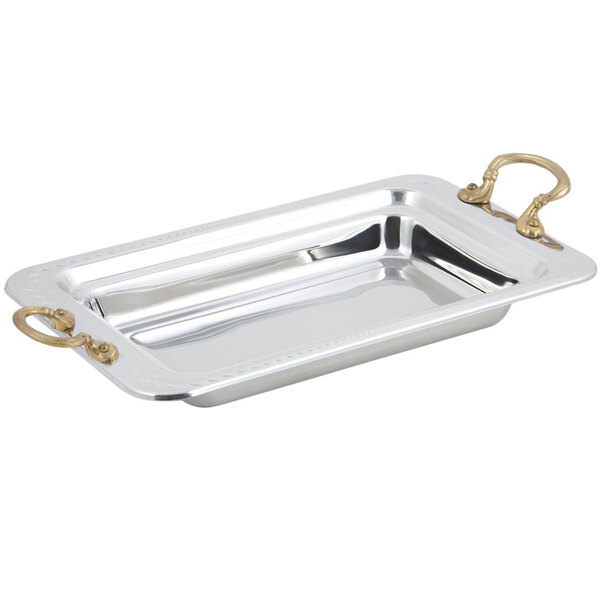 A silver Bon Chef rectangular food pan with round brass handles.