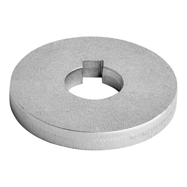 A silver round metal screw cover with a hole in the center.