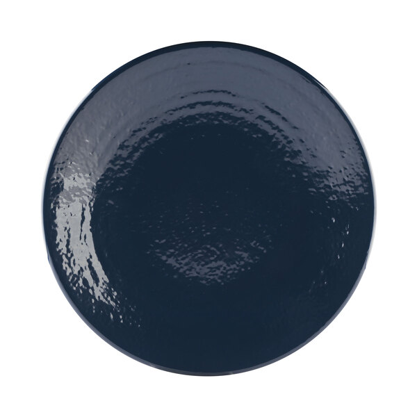 A close-up of an Elite Global Solutions Pebble Creek Lapis-colored round plate with a black rim.