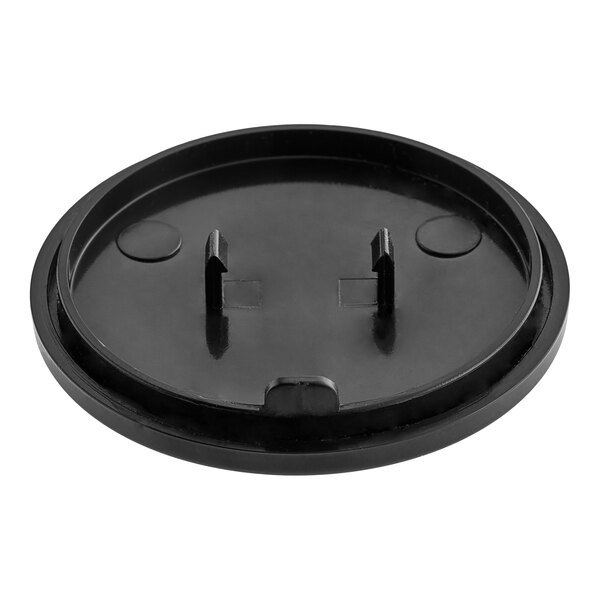 A black round plastic Estella Caffe tap knob cover with two holes.