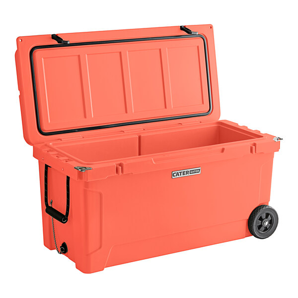 A coral CaterGator outdoor cooler with wheels.