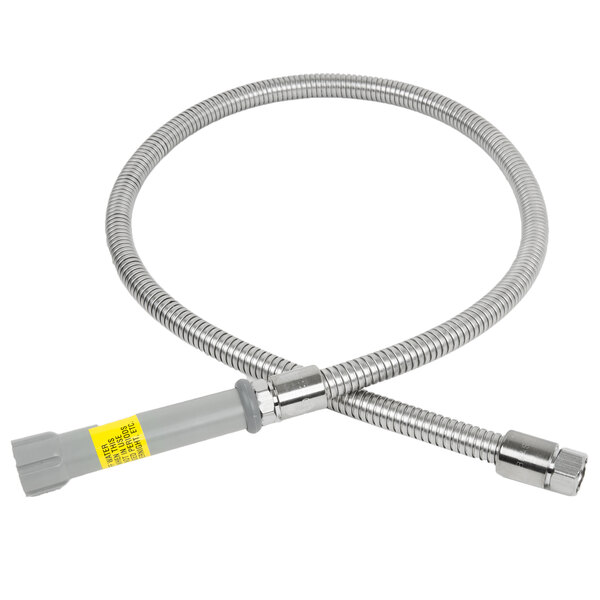 A T&S stainless steel flexible hose with a yellow connector and gray handle.
