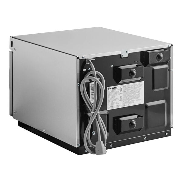 A Solwave stainless steel commercial microwave with a cord attached.