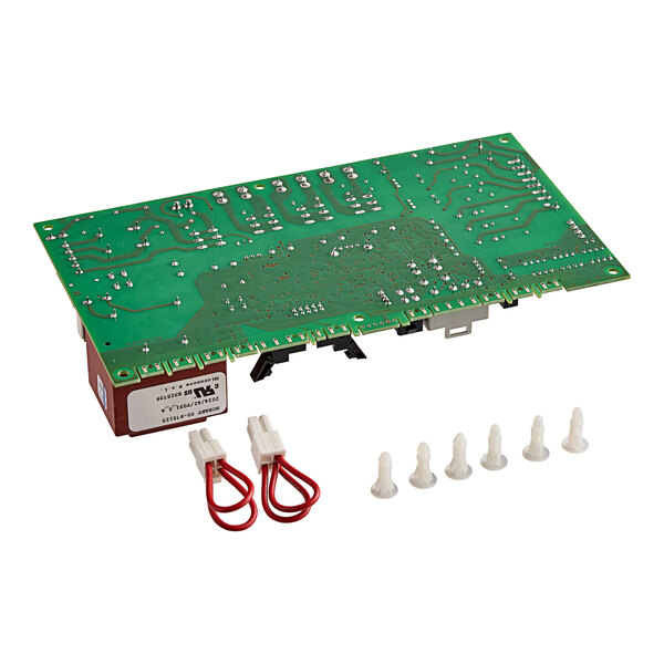 A Noble Warewashing control board with a green circuit board and red and white wire connectors.