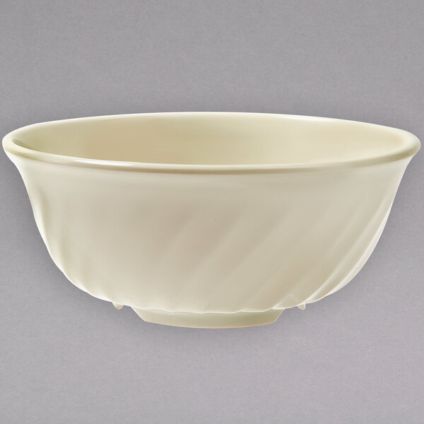 A white bowl with a white rim on a gray background.