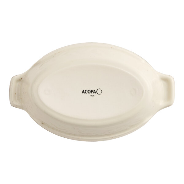 An oval-shaped porcelain baker or casserole dish with handles, shown upside down with the Acopa brand name visible on the bottom.