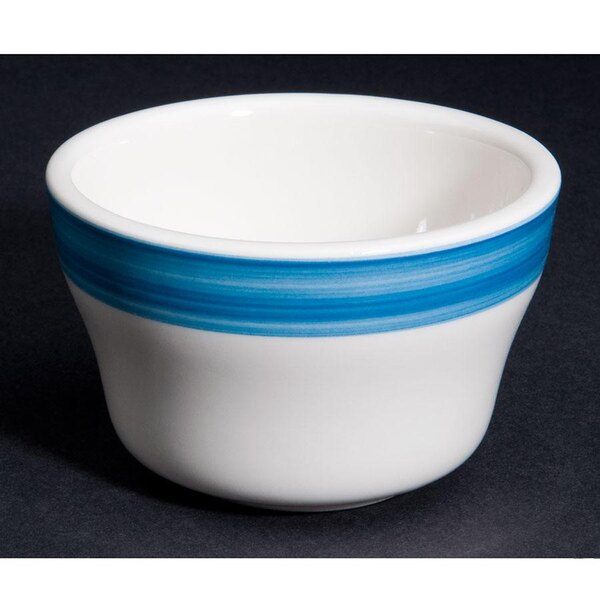A white stoneware bouillon bowl with a blue stripe.