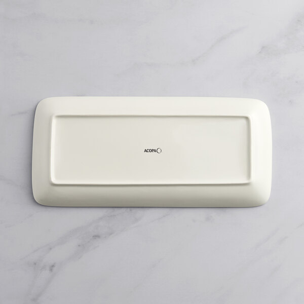 An Acopa Cape rectangular gray porcelain platter on a white surface.