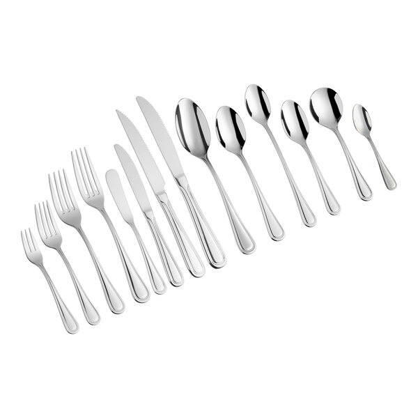 A close-up of Acopa Edgeworth stainless steel oyster, appetizer, and cocktail forks.