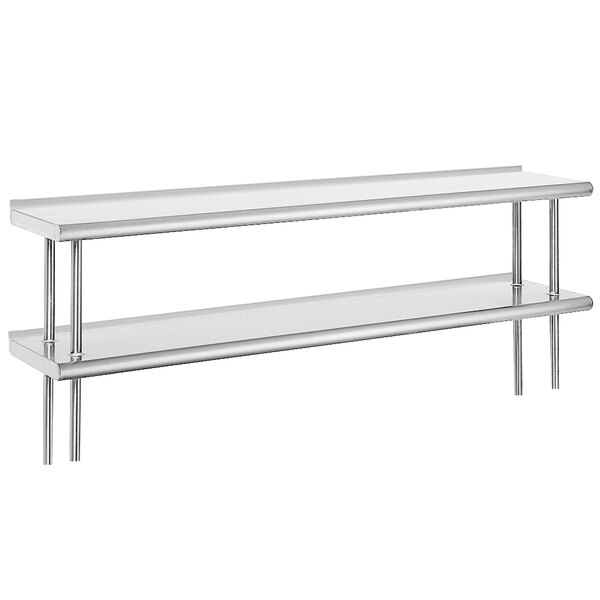 An Advance Tabco stainless steel shelving unit mounted on a table with two shelves.