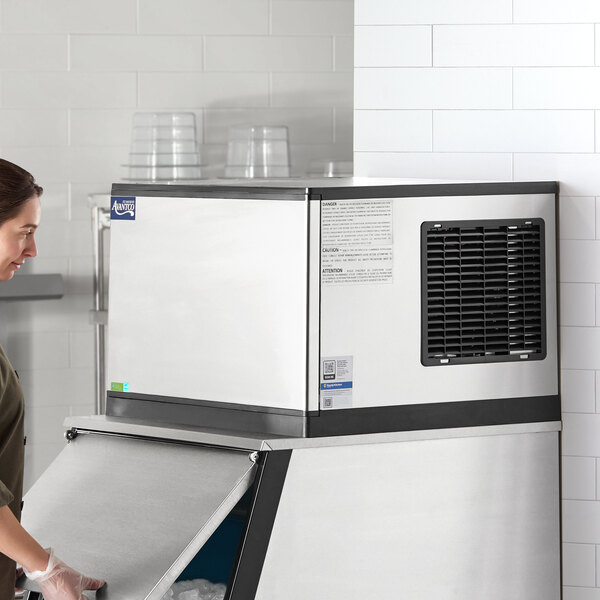 An air-cooled modular half cube ice machine with a stainless steel exterior, designed for commercial use.