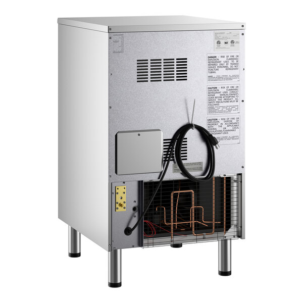 An undercounter air-cooled ice machine with a visible power cord and ventilation panel on the back.