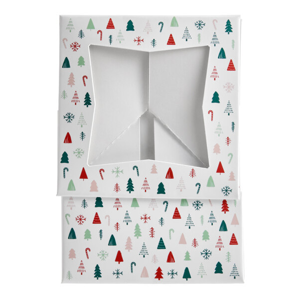 A white bakery box with a modern Christmas print and a star-shaped window on the lid.