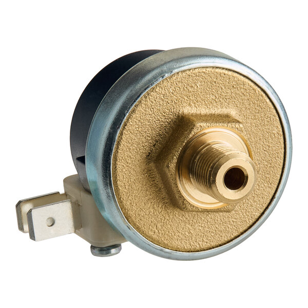 A close-up view of a metallic pressure switch with a threaded brass connector and an electrical terminal.
