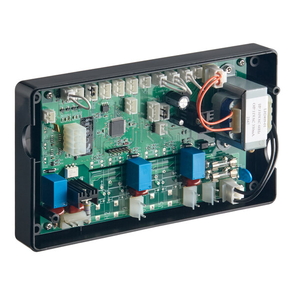 An electronic circuit board with various components, including connectors, capacitors, relays, and a transformer, mounted inside a black rectangular enclosure.